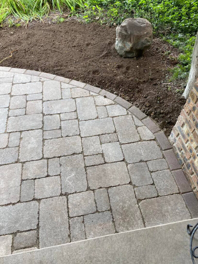 Walkway in backyard with fresh new stones