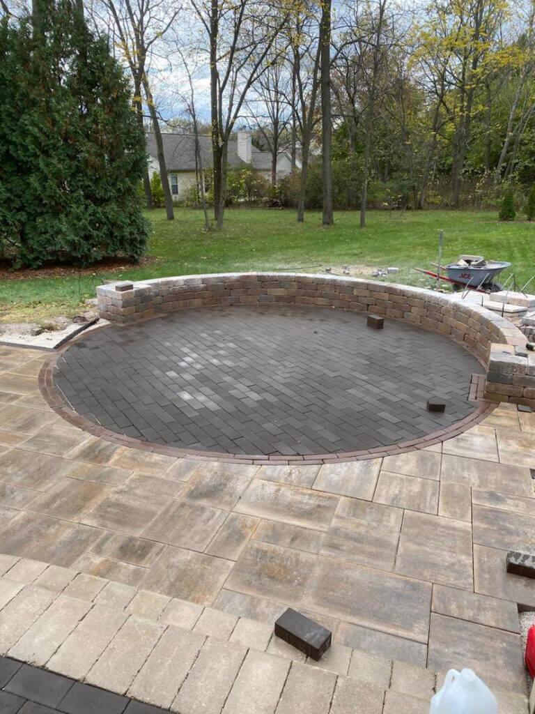 Beautiful firepit in backyard in progress