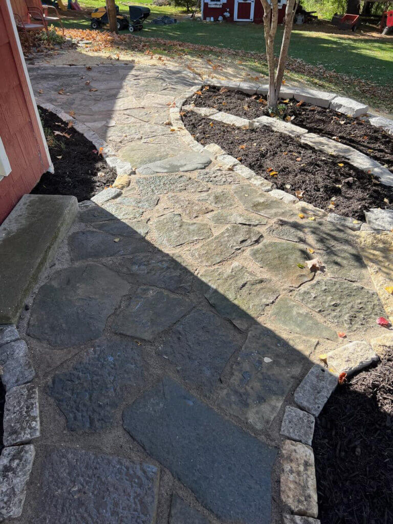 Freshly paved brick with garden in backyard